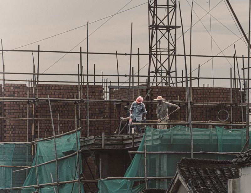 Tower crane and scaffolding on an active industrial construction site